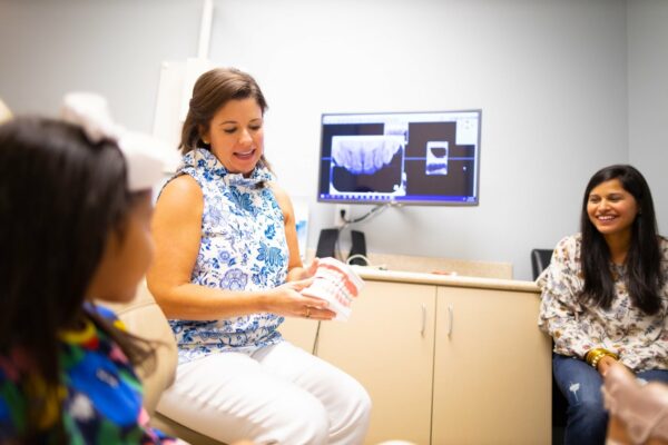 Doctor Candids Beavers and Broomfield Dentistry 2020 Fayetteville Arkansas Dentist 29 600x400 - Should I Floss or Brush First? Find Out More!